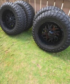 20x10 TIS wheels with 35” AMP tires on a 6x135 bolt pattern