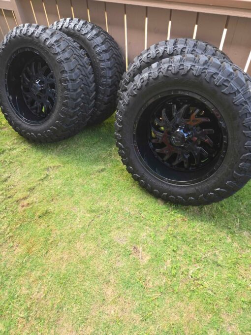 20x10 TIS wheels with 35” AMP tires on a 6x135 bolt pattern